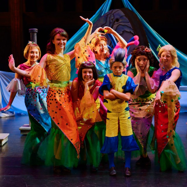 Kids dressed up in costumes during a performance